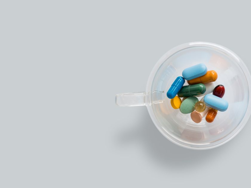 Top view of a cup of pills